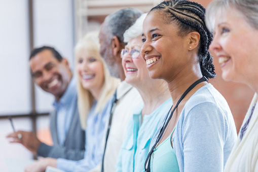 Diverse Group of medical providers holding a meeting